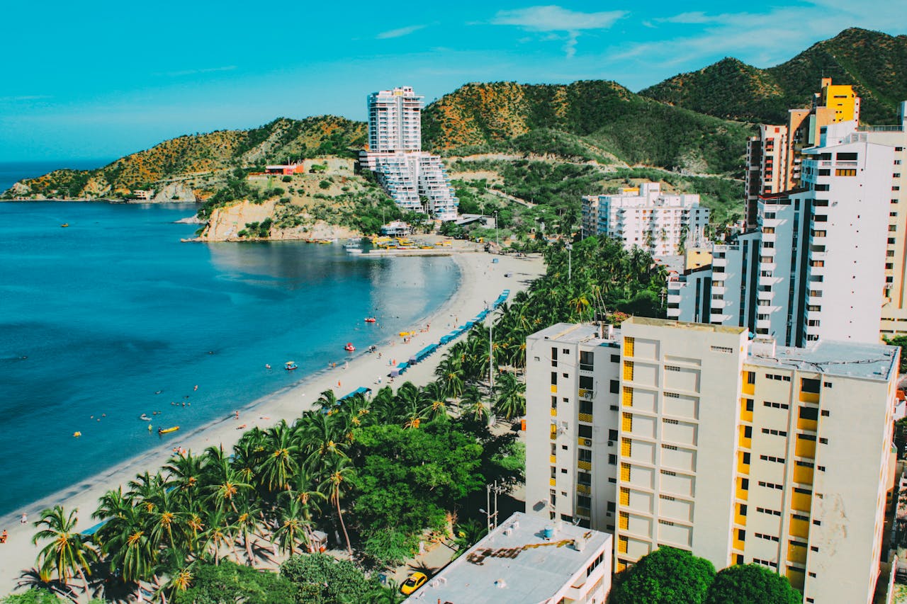 Services A breathtaking aerial view of Santa Martas beachfront, showcasing a blend of nature and modern architecture.