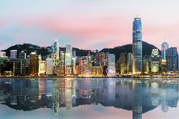 beautiful hong kong, china skyline from across victoria harbor.sunset time